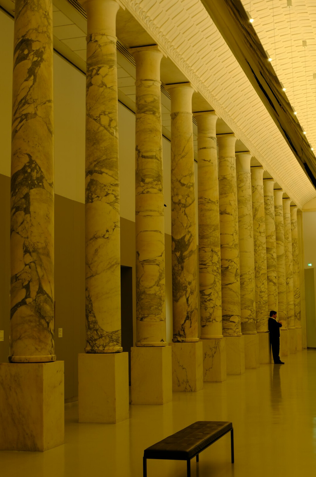 Marble museum hallway with classical columns
