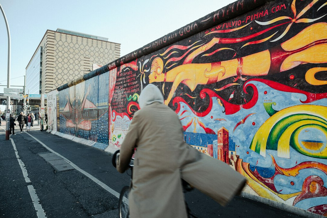 people celebrating berlin wall fall